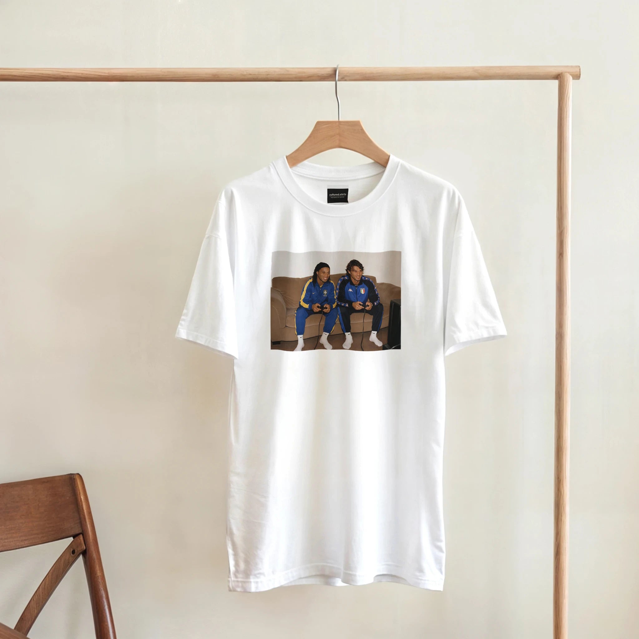 White crew-neck T-shirt with rectangular photo-style player graphic on the front.