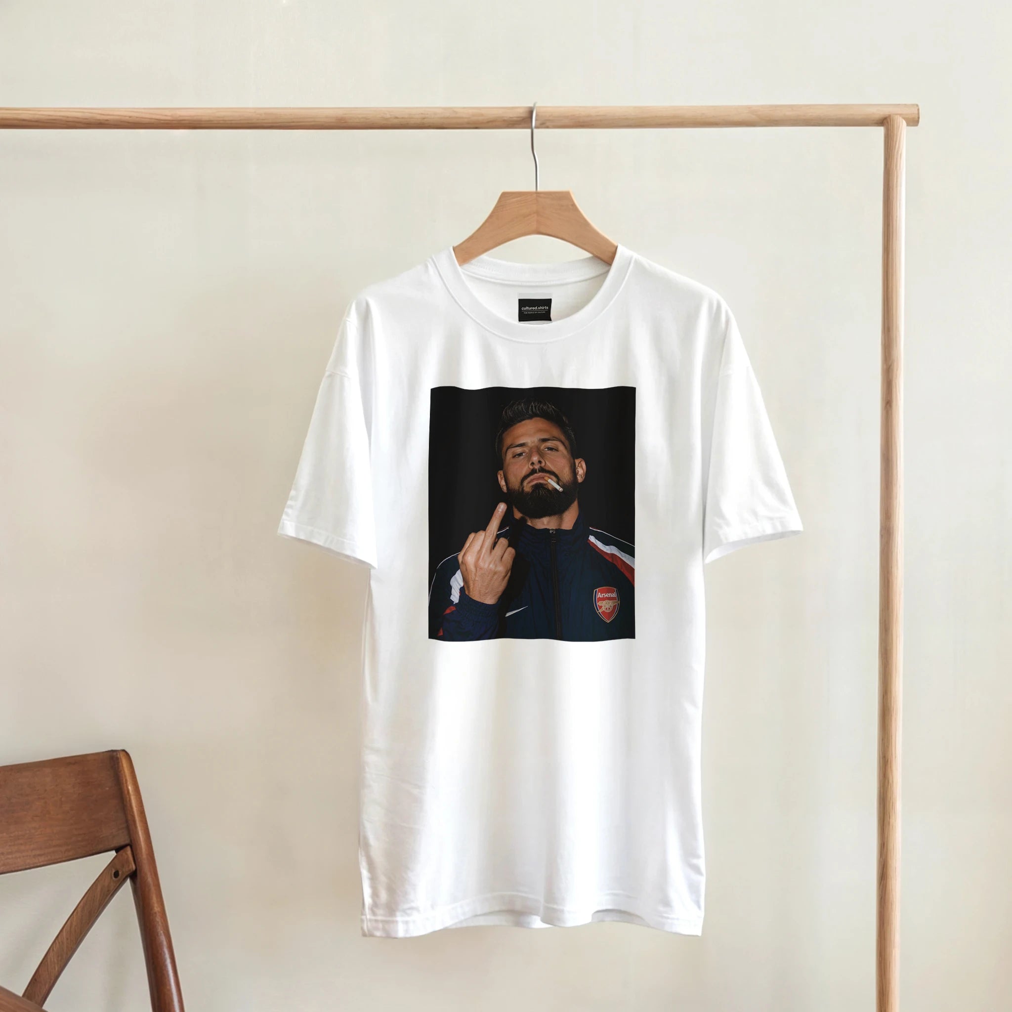 White crew-neck T-shirt with square portrait graphic on the front, hanging