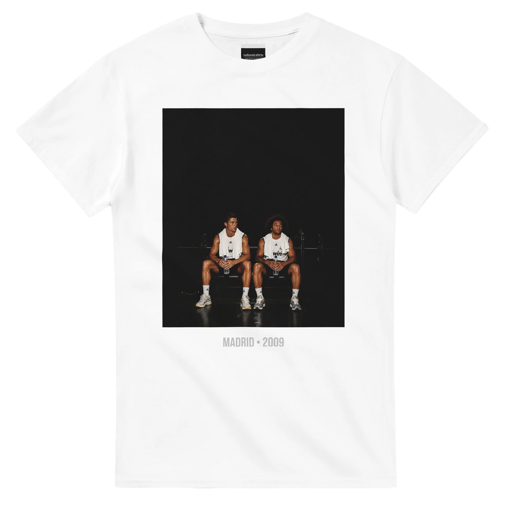 White short-sleeve T-shirt with front graphic of two soccer players and text, Madrid 2009