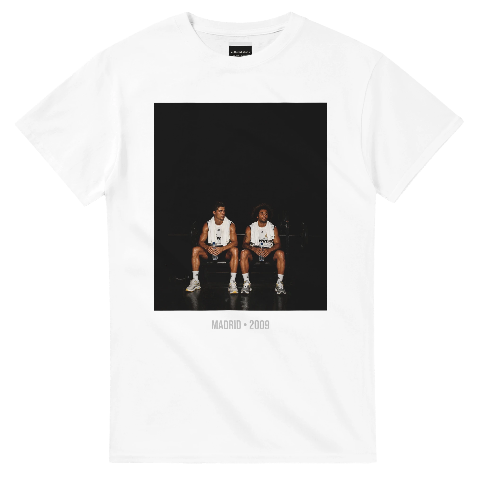White short-sleeve T-shirt with front graphic of two soccer players and text, Madrid 2009