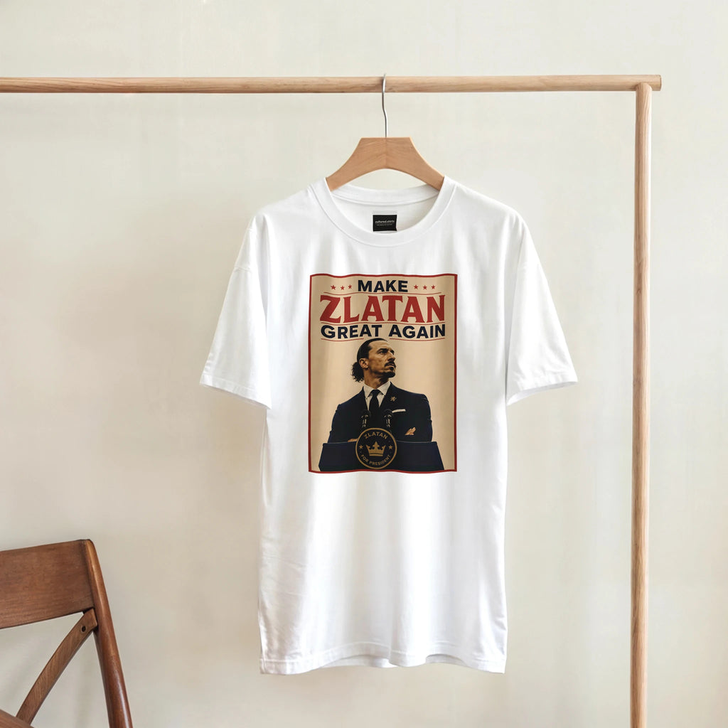 White T-shirt on hanger with “MAKE ZLATAN GREAT AGAIN” front graphic