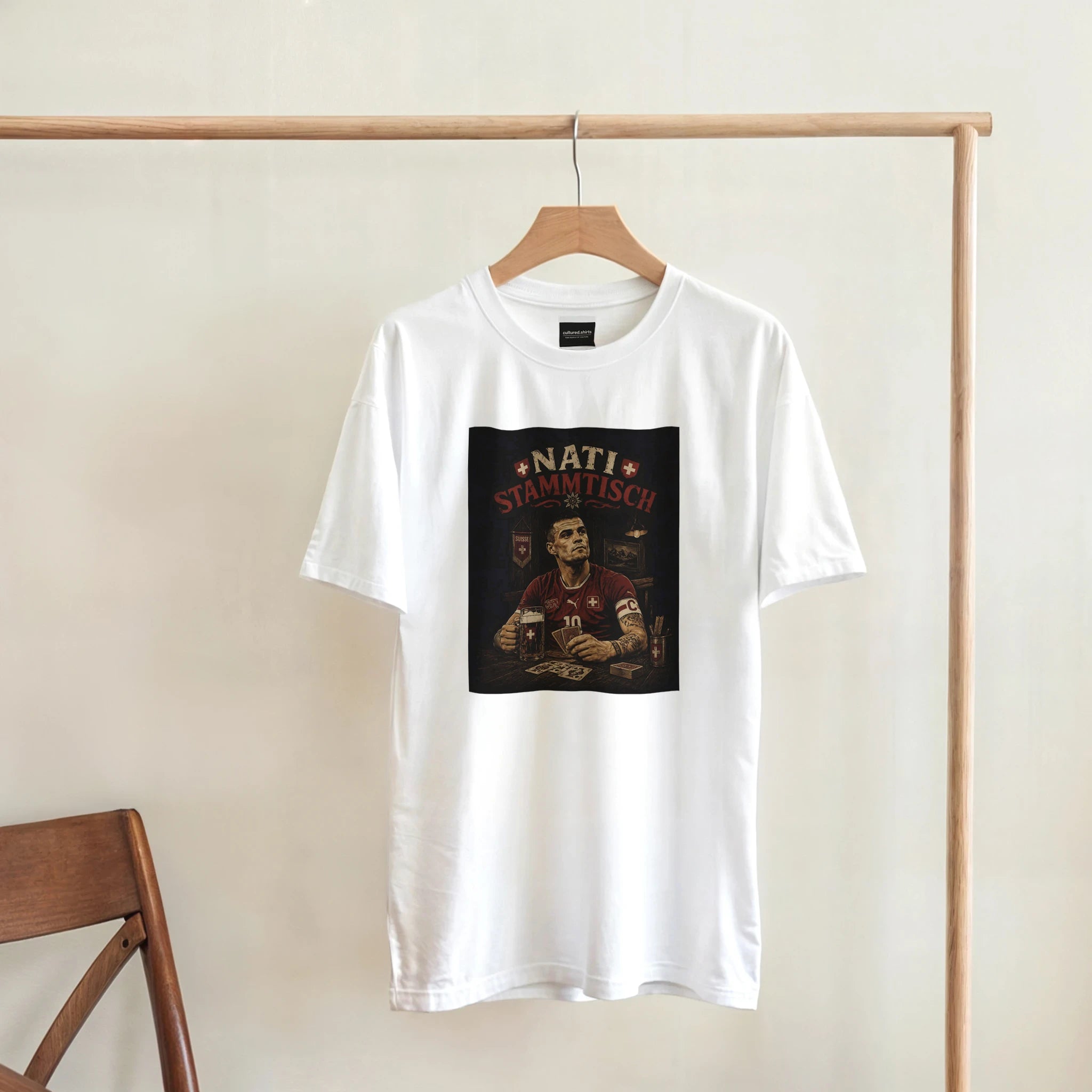 White T-shirt on hanger with square 'Nati Stammisch' graphic print