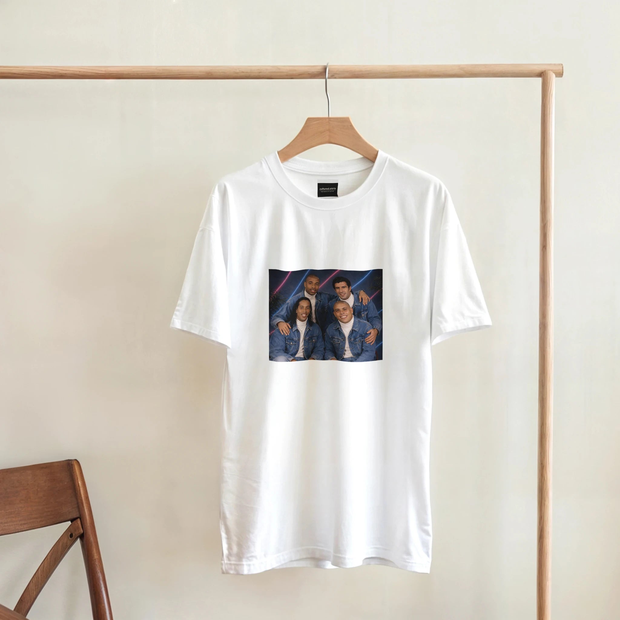 White crew-neck T-shirt with front square graphic on wooden hanger