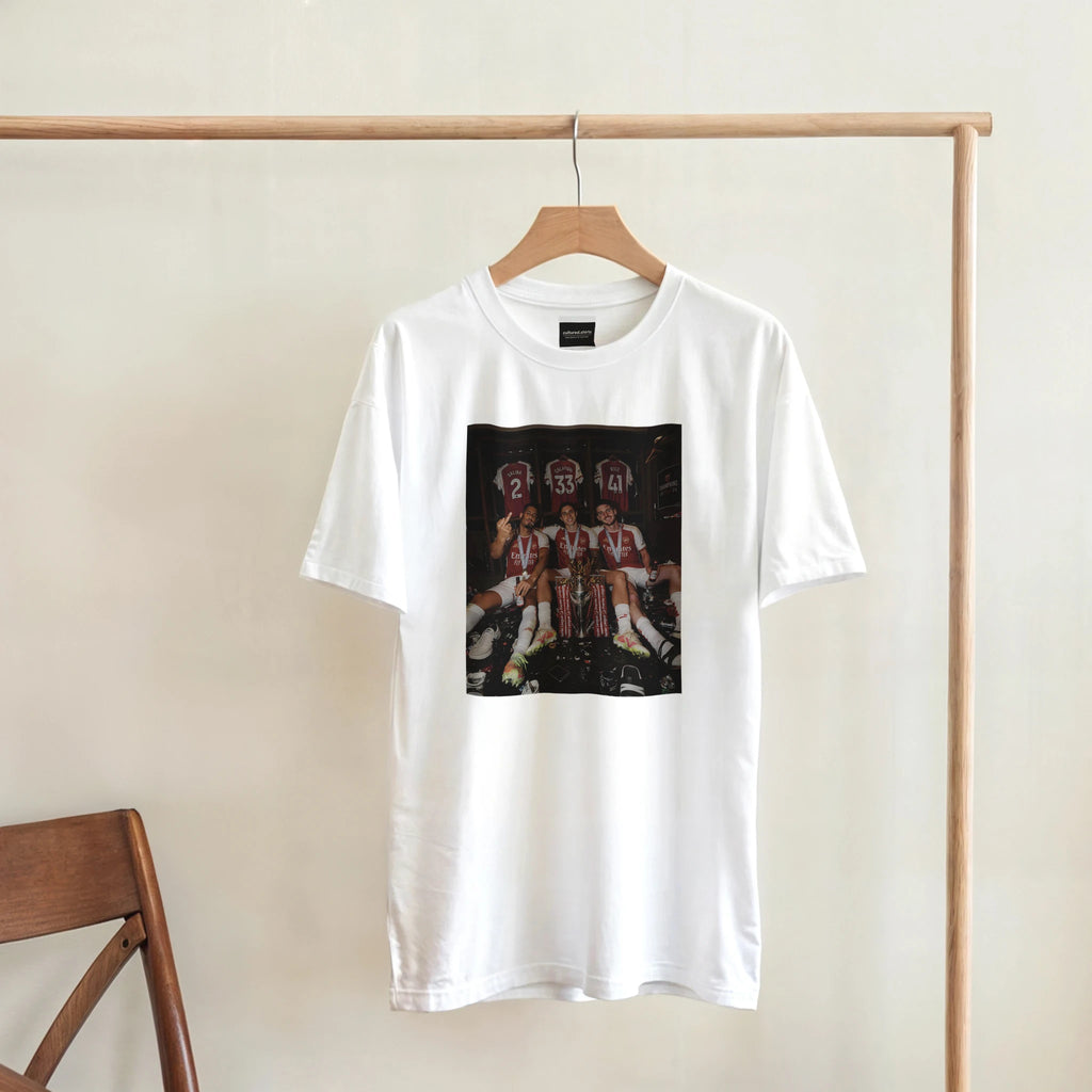 White graphic T-shirt on wooden hanger with rectangular team photo print