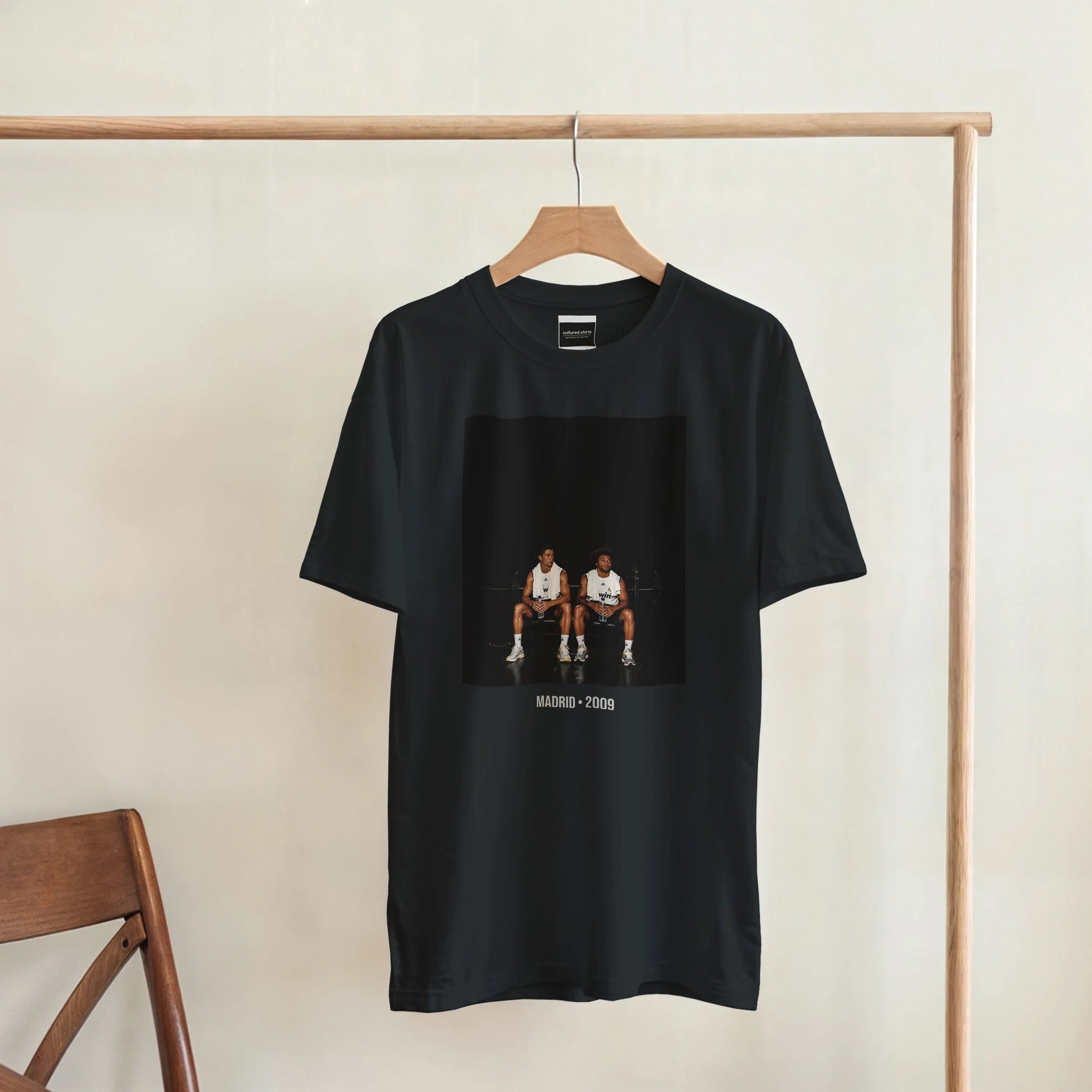 Black short-sleeve T-shirt on hanger with centered front graphic and Madrid 2009 text